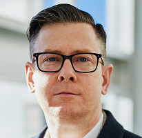 Alexander Hughes, CEO and executive of a crypto trading company, portrait